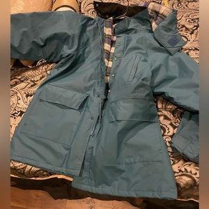 Mens outdoor rain coat/jacket with reinforced stitching. Flannel lining